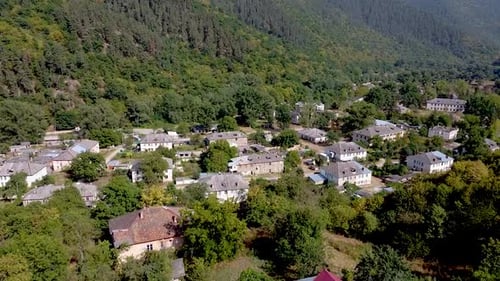 Exploring a quiet mountain village surrounded by nature in autumn