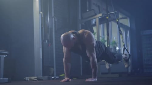 Caucasian Athlete Doing Trx Exercises in Gym