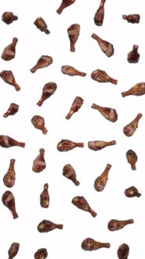 Vertical Falling Grilled Turkey Legs on White