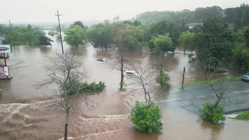 Drone Shot Flooded City Street with Cars and Houses Street After Heavy Rain