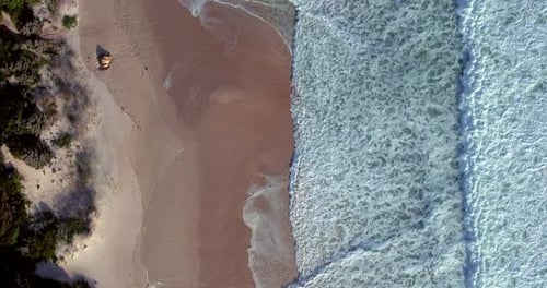 Aerial view, water waves and ocean at beach, sand and landscape of nature