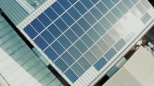 Solar Panels Installed on the Roof of the Building Drone View