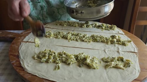 Grandmother Filling Pie Dough with Delightful Ingredients, Cherishing Traditional Balkans Culinary C
