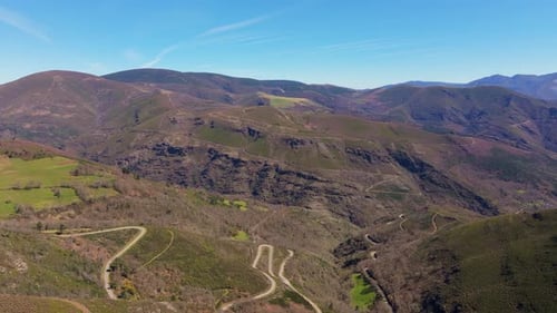 Aerial View Of The Winding Road In The Mountains In A Casela, Samos, Spain. Aerial Drone Shot