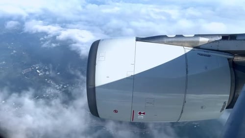 Airplane Engine Flying Over Tropical Terrain