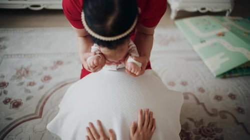 Baby Stretches with Women Guiding From Above