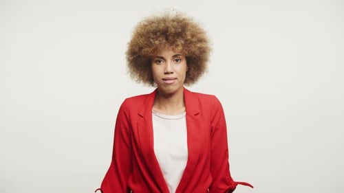 Attractive Woman Stares at Camera Smiling