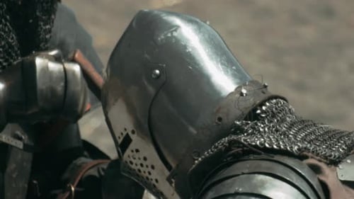 Macro close up of armoured knights fighting with dangerous weapons during summer day. Getting powerf