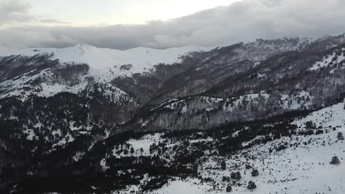 Snowy Mountain Range Aerial View in Winter