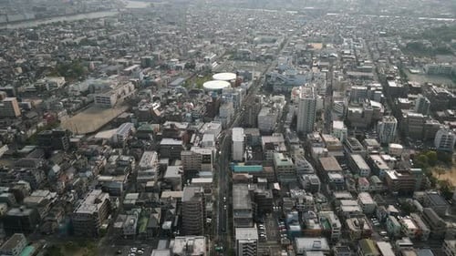 Aerial Scenic Urban Drone Footage of a neighborhood, streets and buildings in the Capital City of To