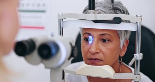 Eye care, laser test and woman in office with doctor to check iris, pupil and sight