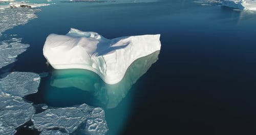 Iceberg Drift Icy Antarctic Ocean in Sunny Day