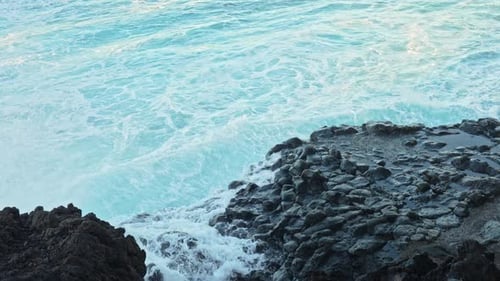 Ocean Waves Crashing on Rocky Shore