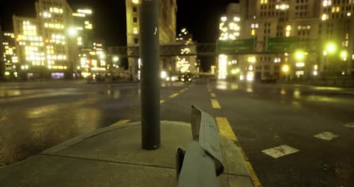 City Streets Glow at Night with Vibrant Lights and Reflections on Pavement