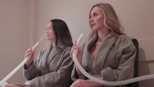 Mineral Vapor Inhalation Treatment in Wellness Spa Center With Two Young Females - Slow Motion