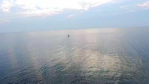 Kayaker Floating in Sea on Evening Sky Landscape. Drone View Kayaker Training