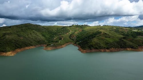 Aerial Hyperlapse Lake Calima Clouds Moving. Mountain Shadows.
