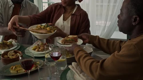 Group of Adults Sharing a Meal at Home
