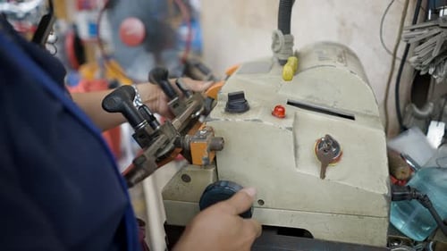 Woman Locksmith Is Making A Key Duplicate In The Street Of Bangkok Thailand