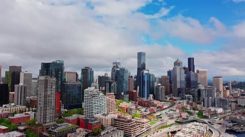 Aerial drone view of downtown Seattle, Washington, showcasing skyscrapers, urban streets, and the