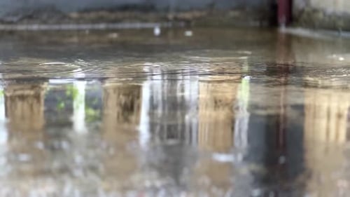 Rainy season. Puddles of water in rainy day.