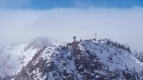 Light Snowfall on Rocky Summit at Palisades Tahoe California USA