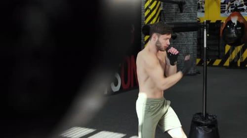 Man Practicing Boxing Punches at the Gym