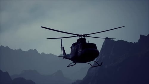 A Helicopter is Flying Over a Mountain Range