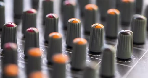 Close Up Of Mixing Console Knobs Used To Control And Balance The Audio On Speakers.