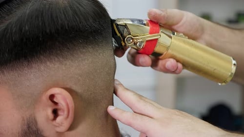 Man Receives Haircut From Barber Shop Hair Trimmer