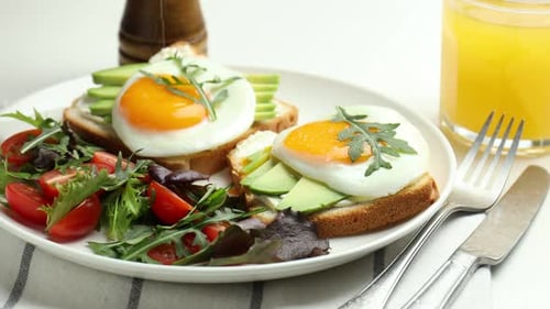 Healthy Breakfast: Toast with Egg, Avocado, and Salad
