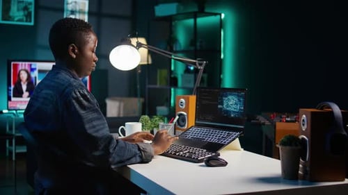 Artificial Intelligence Engineer Working From Home Using Notebook