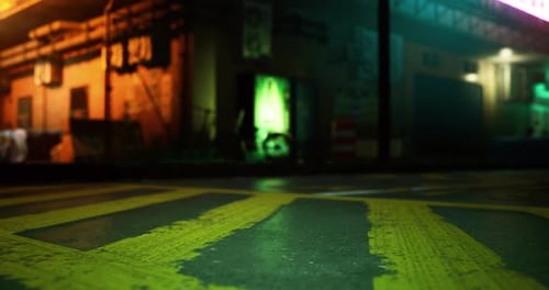 Urban Night View with Illuminated Building and Colorful Pavement Patterns