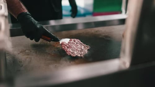 Burger Patty Cooking on a Grill