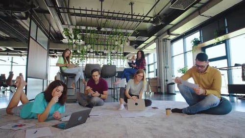 Team Collaborates in Modern Relaxed Office Space