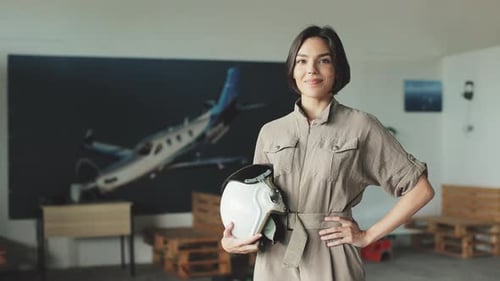 Female Navigator with Helmet Looking at Camera and Smiling
