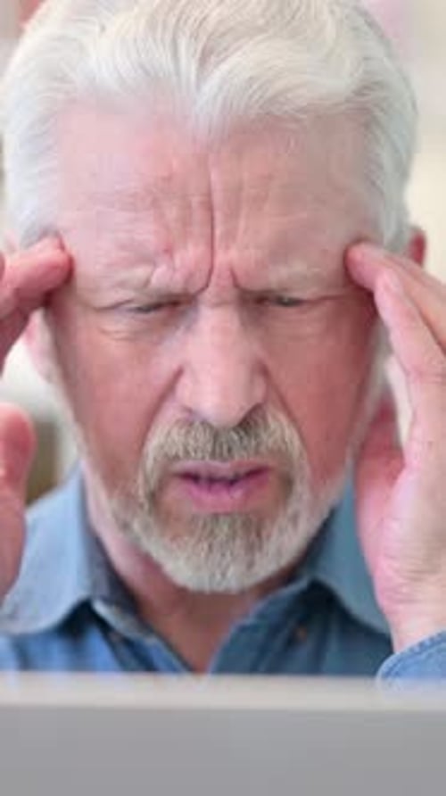 Close Up of Old Businessman having Headache at Work, vertical video