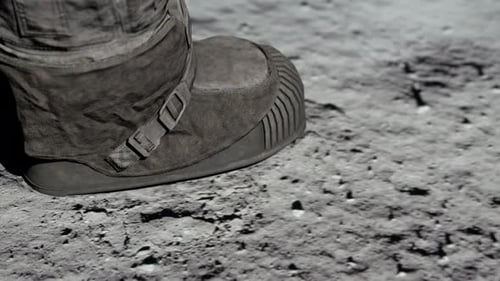 Astronaut Boot Steps on Moon Surface Leaving Footprint