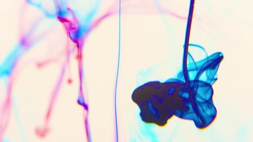 Abstract Shot of Colorful Ink Swirling and Mixing