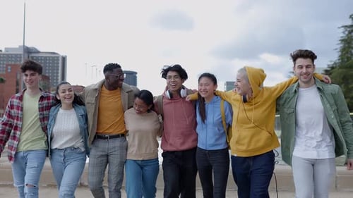 Young Group of Teenage Friends Walking Together in City Street