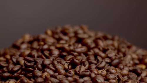 Closeup Heap Roasted Coffee Beans. Beautiful Textured View Perfect Brown Coffee Seeds