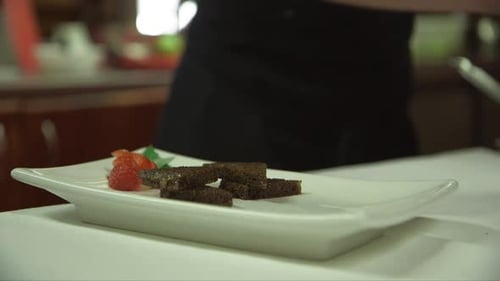 Chef Preparing Food Plate in Restaurant Kitchen