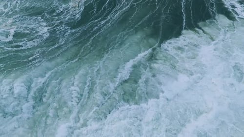 CloseUp of Turbulent Ocean Currents with Foamy Patterns