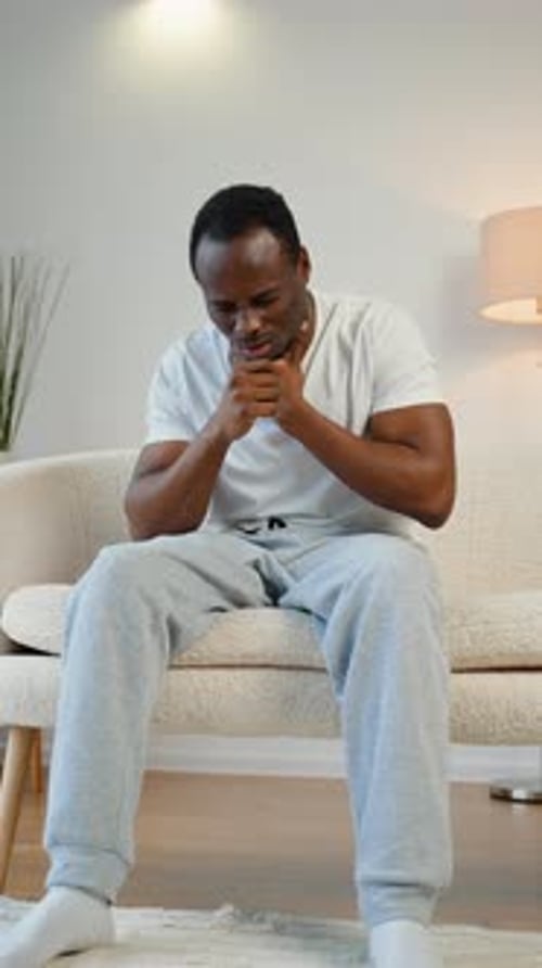 Black Man with Pain in Throat in Home Interior Health Problems Concept Vertical Video
