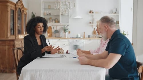 Meeting with Real Estate Agent Elderly Spouses Buying or Selling New House Black Woman and Mature