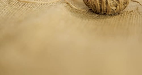 Reveal Shot Of A Ball Of Jute, A Hessian And Burlap Type Of Natural Fibre Textile
