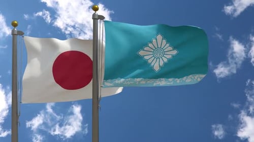 Japan and Okinawa Prefecture Flags Waving in Blue Sky