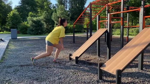 Woman Doing Step Exercises in an Outdoor Gym