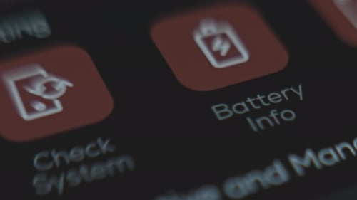Finger Taps 'Battery Info' App on Smartphone