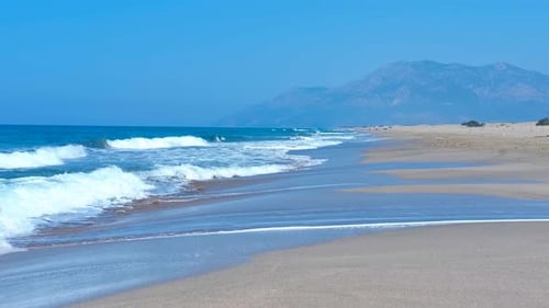 Mediterranean Sea Gently Lapping on a Secluded Beach
